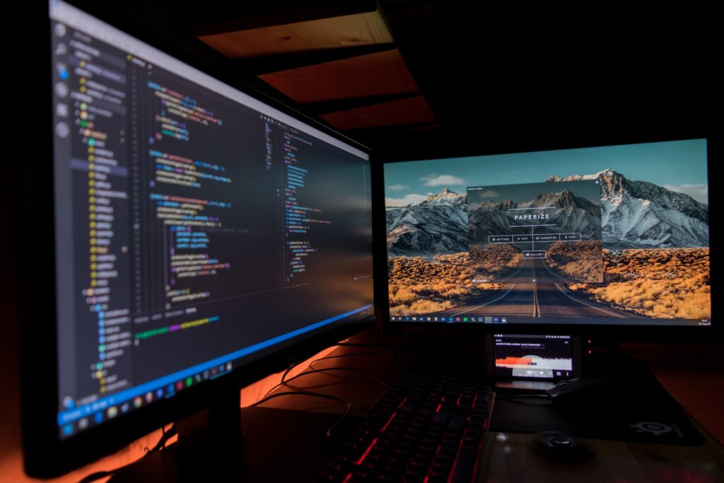 two desktop monitors