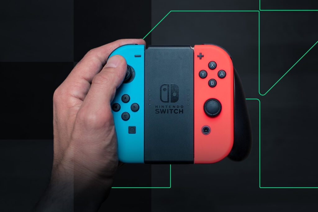 Someone holding Switch controllers.