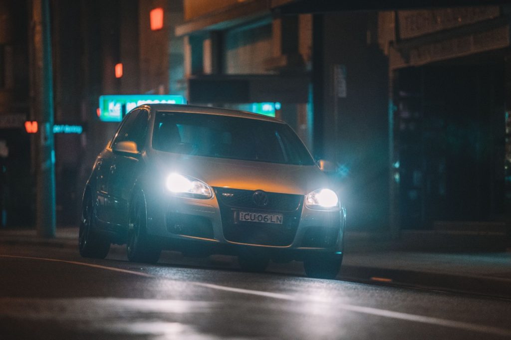 A car driving at night.