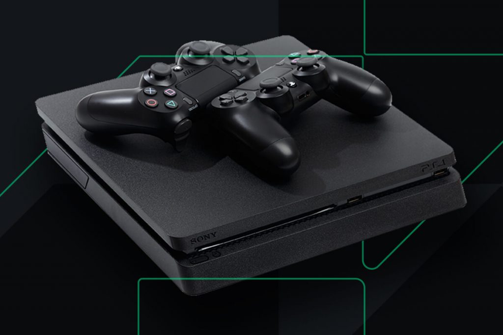 2 PS4 controllers on top of a black PS4