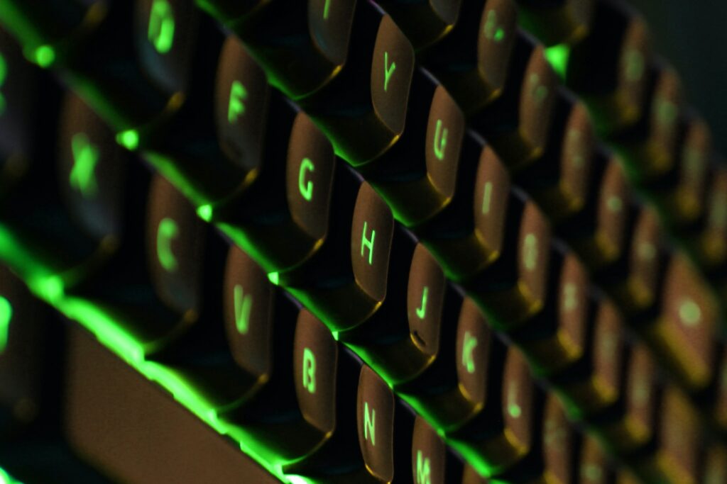 a gaming keyboard with a green glow