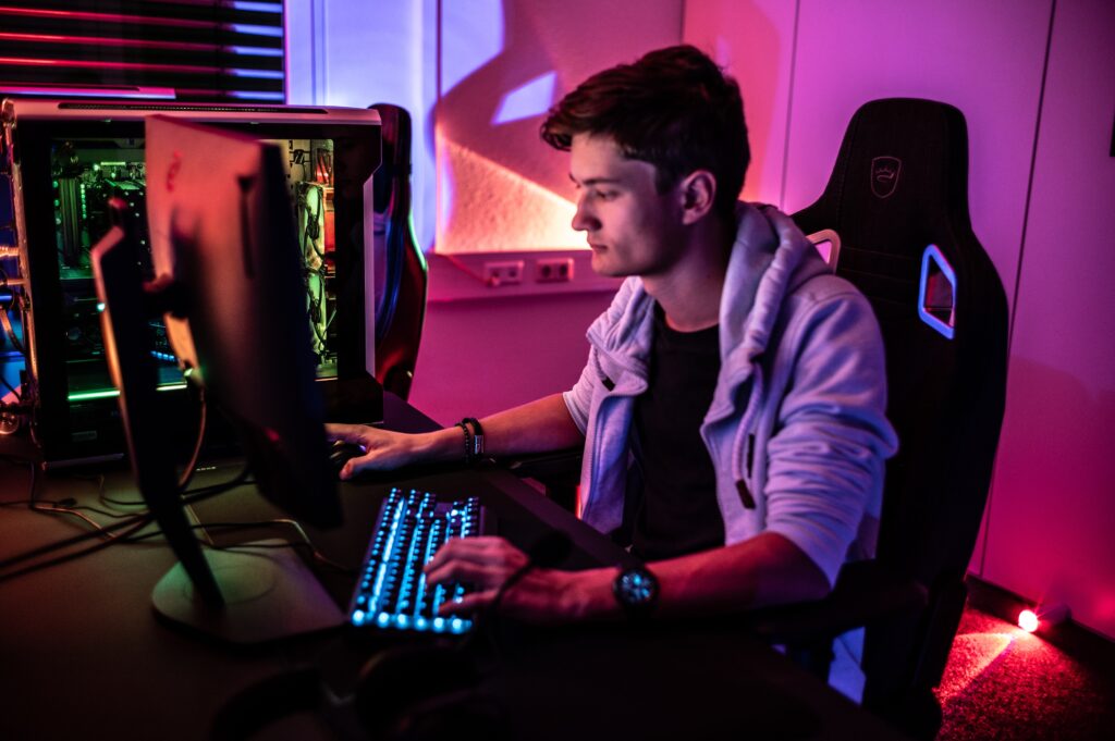 person in a gaming chair playing video games