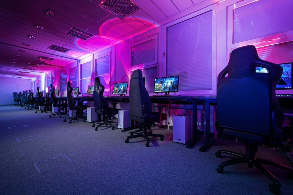 professional gaming chairs and computers with neon lights