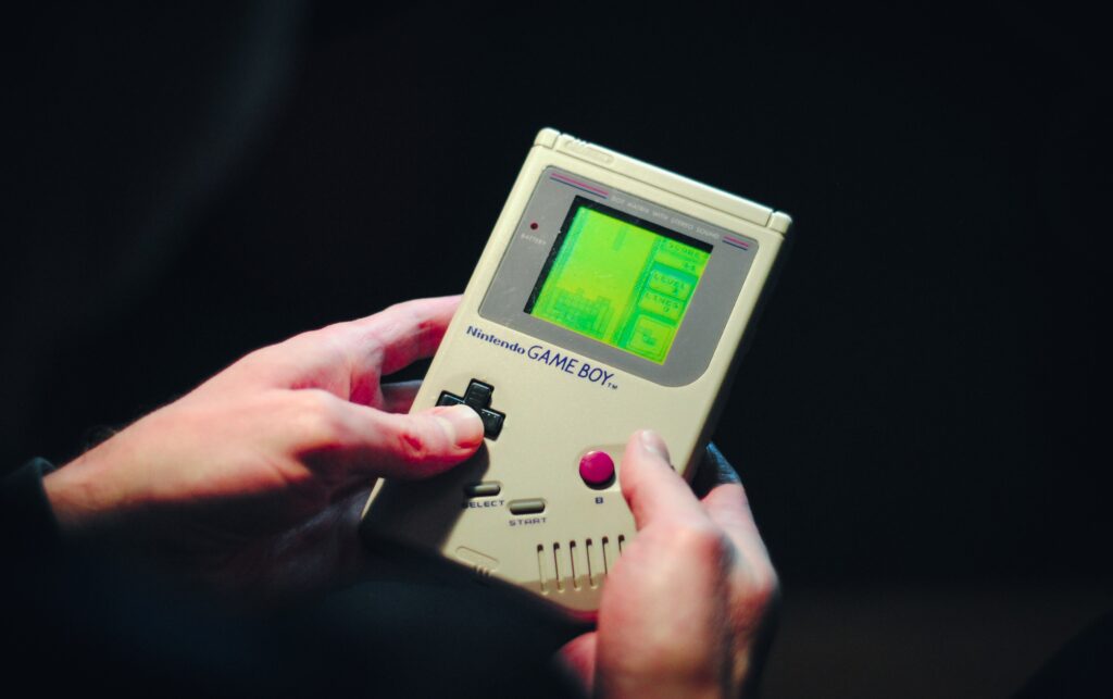 person holding a game boy