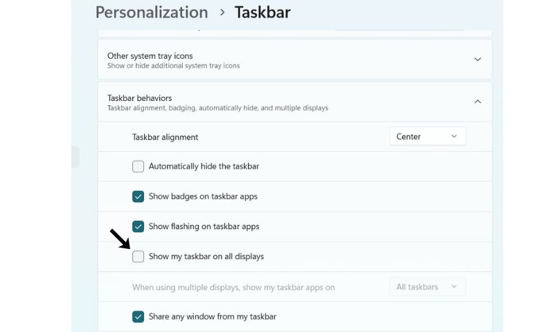Taskbar settings in Windows with "Show my taskbar on all displays" unchecked.
