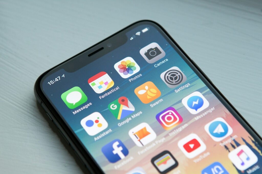 A black iPhone on the home screen