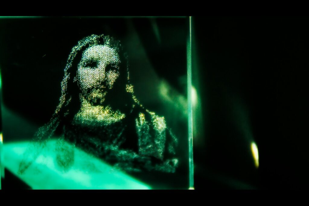 A blurry image of Jesus in green