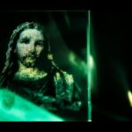 A blurry image of Jesus in green